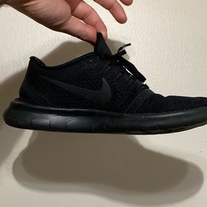 Nike Frees, all black